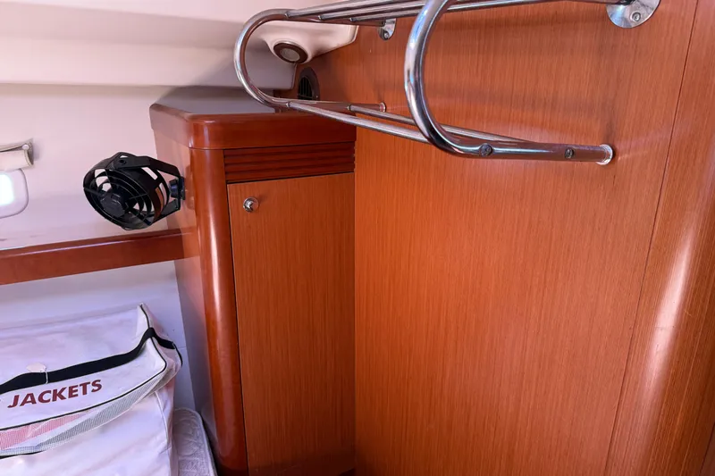 Magic Maddie 2 Yacht Photos Pics Interior of 2010 Beneteau Oceanis 43 yacht with wooden cabinetry and storage area.