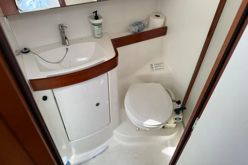 Magic Maddie 2 Yacht Photos Pics Bathroom interior of 2010 Beneteau Oceanis 43 yacht, featuring sink and toilet.