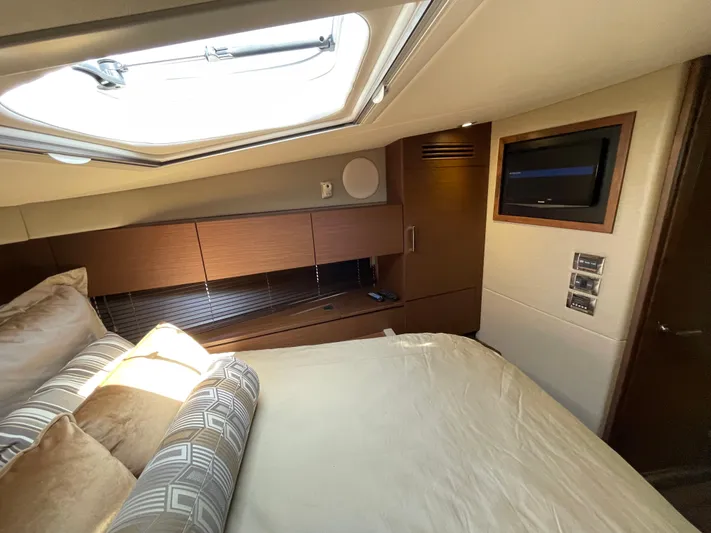 Southern Accent Yacht Photos Pics Luxurious cabin interior of 2014 Sea Ray 470 Sundancer yacht with skylight and TV.