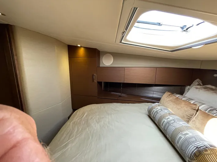 Southern Accent Yacht Photos Pics Luxurious cabin interior of 2014 Sea Ray 470 Sundancer yacht with skylight and plush bedding.