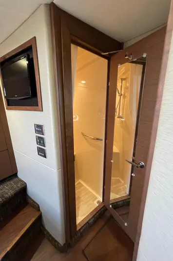 Southern Accent Yacht Photos Pics 2014 Sea Ray 470 Sundancer interior shower with glass door and modern fixtures.