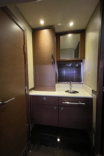 Southern Accent Yacht Photos Pics Interior of 2014 Sea Ray 470 Sundancer yacht bathroom with modern fixtures and wood cabinetry.