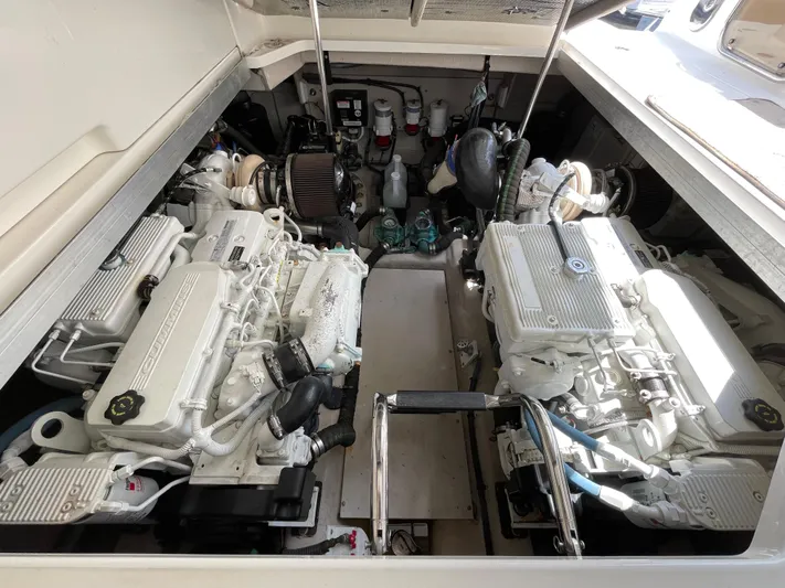 Southern Accent Yacht Photos Pics Engine room of 2014 Sea Ray 470 Sundancer yacht, showcasing dual engines.