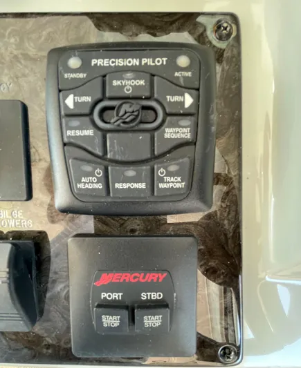 Southern Accent Yacht Photos Pics Control panel of a 2014 Sea Ray 470 Sundancer boat with Mercury Precision Pilot.