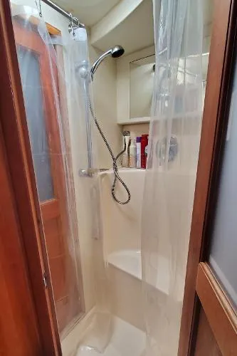 Cash In Advance Yacht Photos Pics 2003 Silverton 38C yacht shower with curtain and handheld showerhead.