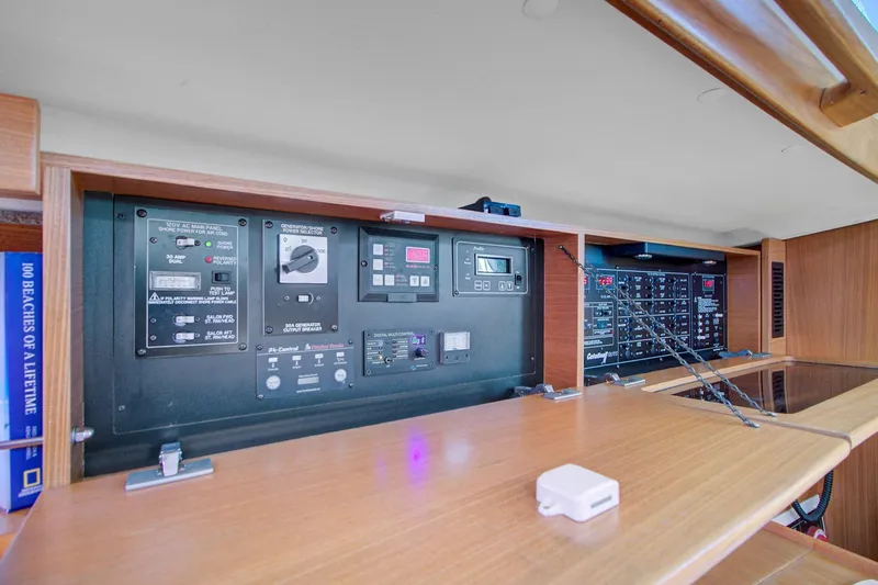  Yacht Photos Pics Electrical control panel inside a 2011 Catalina 445 yacht, featuring various switches and displays.