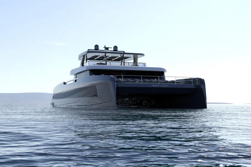  Yacht Photos Pics Luxurious 2027 Moon 9ty yacht on calm waters under clear sky.