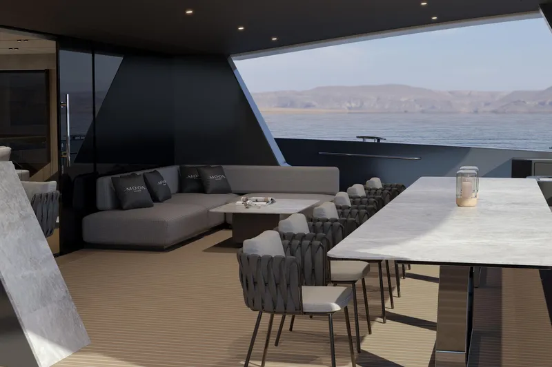  Yacht Photos Pics Luxurious interior of 2027 Moon 9ty yacht with elegant seating and ocean view.