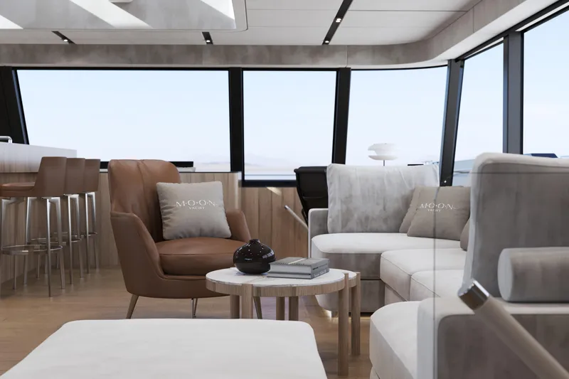  Yacht Photos Pics Luxurious interior of 2027 Moon 9ty yacht with modern seating and panoramic windows.