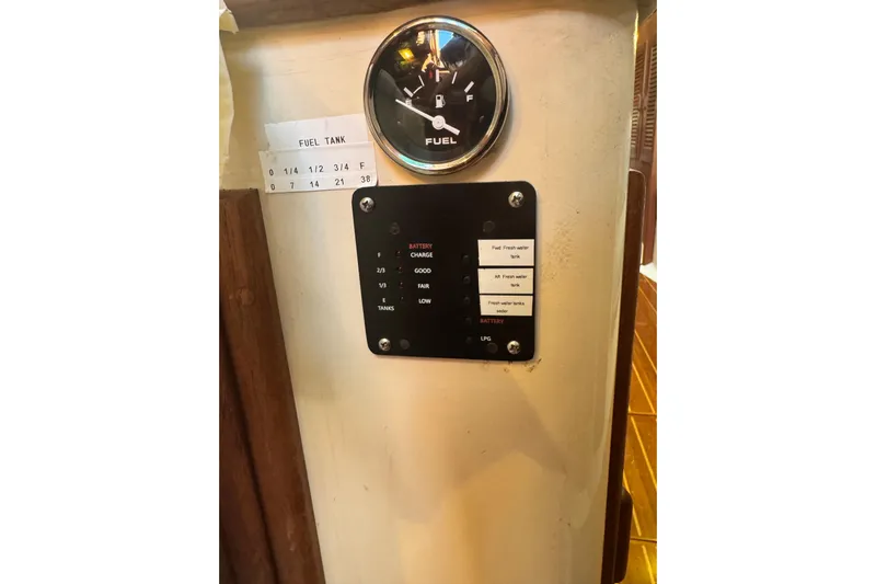 Juniper Yacht Photos Pics Fuel gauge and control panel on 1988 Pacific Seacraft 34 sailboat interior.