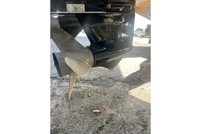  Yacht Photos Pics Propeller of 2008 Donzi 38 ZFX Open boat on pavement background.