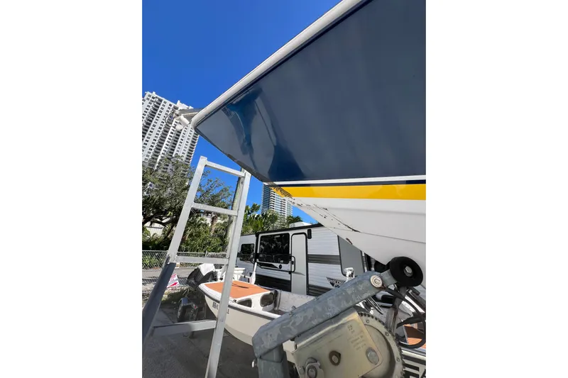  Yacht Photos Pics 2008 Donzi 38 ZFX Open boat on trailer, urban background, clear blue sky.