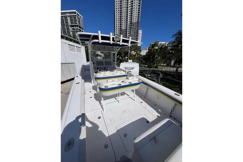  Yacht Photos Pics 2008 Donzi 38 ZFX Open boat with spacious deck, urban backdrop, and clear blue sky.