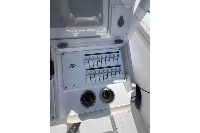  Yacht Photos Pics Control panel of a 2008 Donzi 38 ZFX Open boat with switches and outlets.