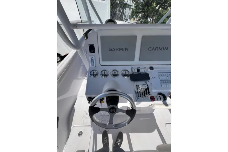  Yacht Photos Pics 2008 Donzi 38 ZFX Open boat dashboard with Garmin displays and steering wheel.