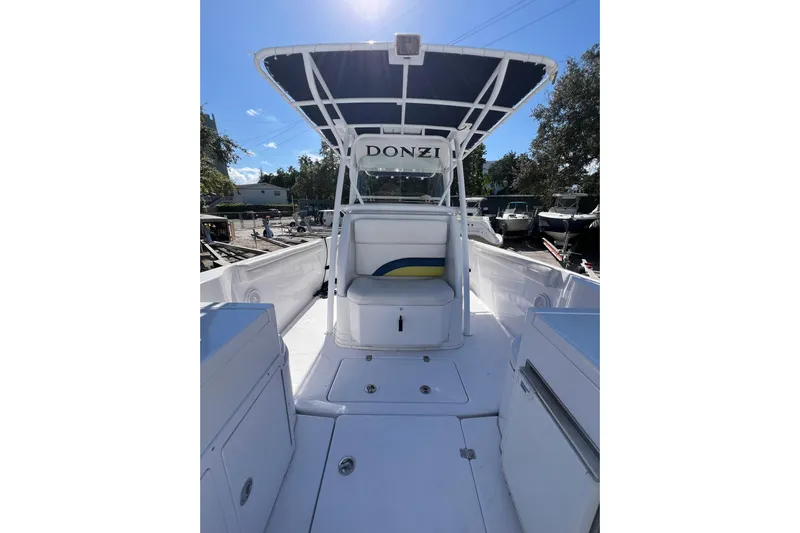  Yacht Photos Pics 2008 Donzi 38 ZFX Open boat interior with seating and canopy under clear sky.