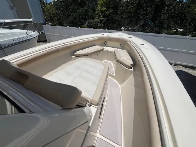  Yacht Photos Pics 2018 Scout 300LXF boat interior with cushioned seating and sleek design.