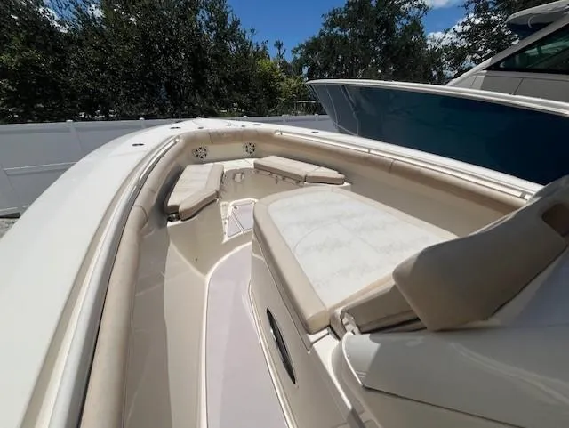  Yacht Photos Pics 2018 Scout 300LXF boat interior with cushioned seating and sleek design.