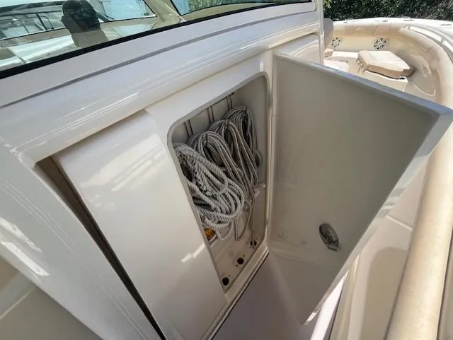  Yacht Photos Pics 2018 Scout 300LXF boat storage compartment with coiled ropes.
