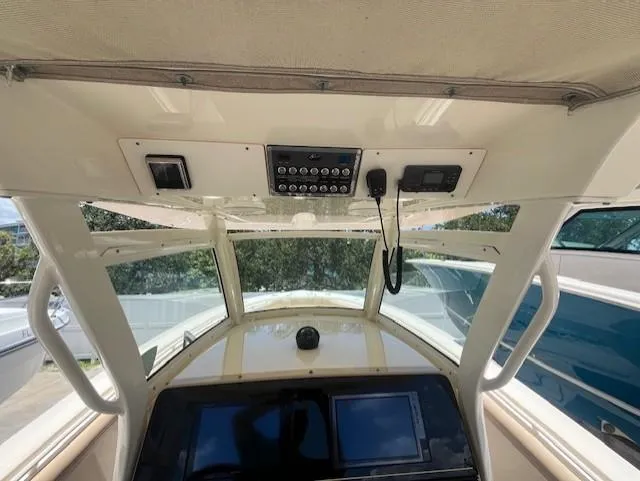  Yacht Photos Pics 2018 Scout 300LXF boat dashboard with navigation controls and display screens.