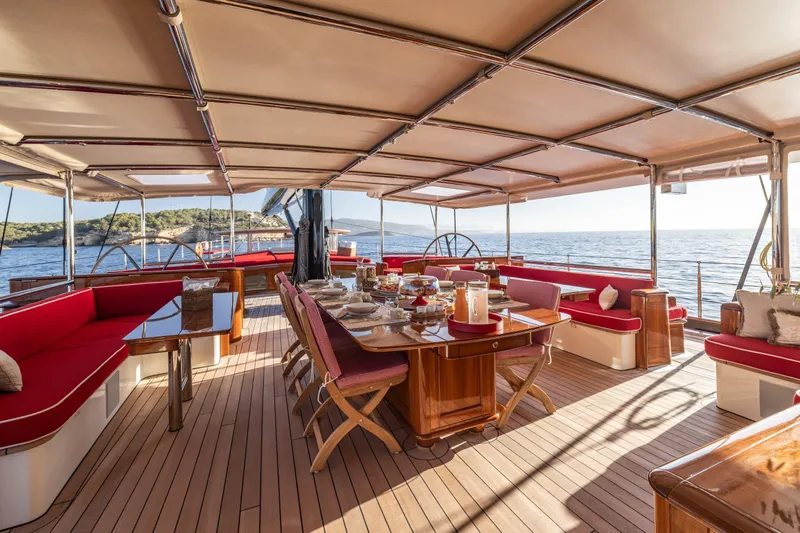 Maximus Yacht Photos Pics Luxurious 2023 Vitters Cruising Ketch deck with elegant dining setup and ocean view.