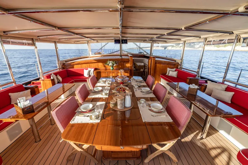Maximus Yacht Photos Pics Luxurious dining area on 2023 Vitters Cruising Ketch yacht with elegant table setting.