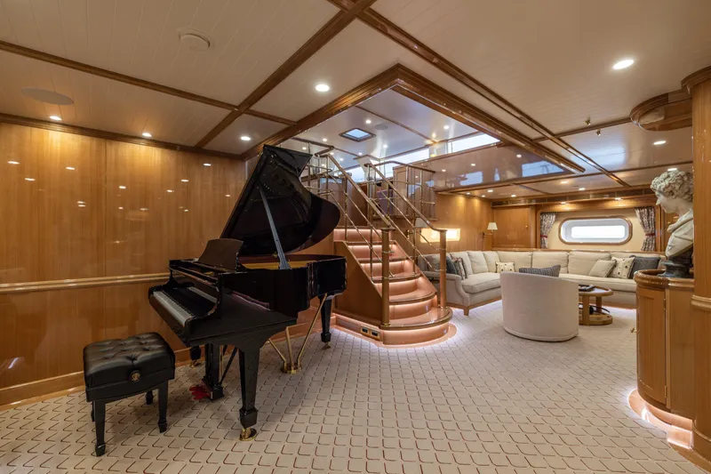 Maximus Yacht Photos Pics Luxurious interior of 2023 Vitters Cruising Ketch with grand piano and elegant seating area.