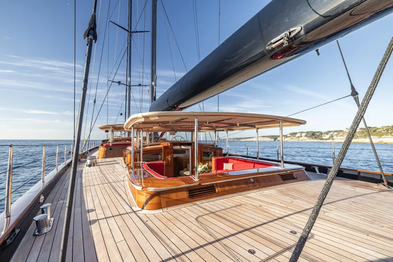 Maximus Yacht Photos Pics 2023 Vitters Cruising Ketch yacht with wooden deck and luxurious seating, sailing on calm waters.
