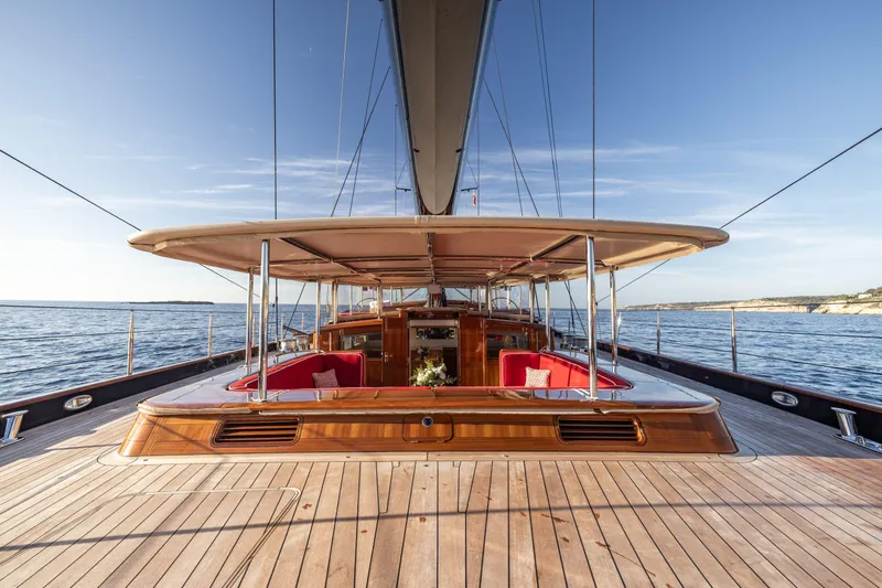 Maximus Yacht Photos Pics 2023 Vitters Cruising Ketch yacht with elegant wooden deck and spacious seating area.