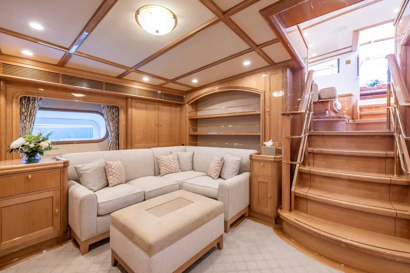 Maximus Yacht Photos Pics Luxurious interior of 2023 Vitters Cruising Ketch with elegant woodwork and plush seating.