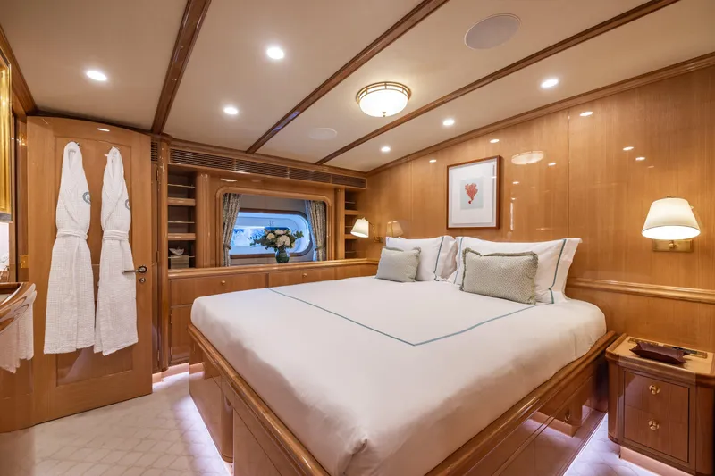 Maximus Yacht Photos Pics Luxurious 2023 Vitters Cruising Ketch cabin with elegant wood paneling and plush bedding.