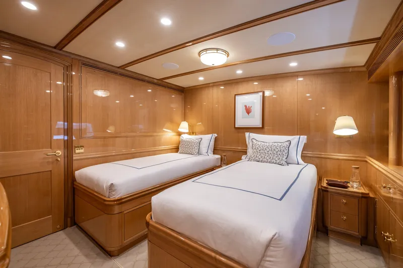 Maximus Yacht Photos Pics Luxurious twin cabin interior on 2023 Vitters Cruising Ketch yacht, featuring elegant wood paneling.