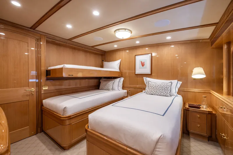 Maximus Yacht Photos Pics Luxurious cabin interior of 2023 Vitters Cruising Ketch with twin beds and elegant wood paneling.