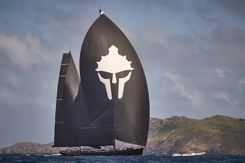 Maximus Yacht Photos Pics 2023 Vitters Cruising Ketch sailing with black sails and a distinctive logo.