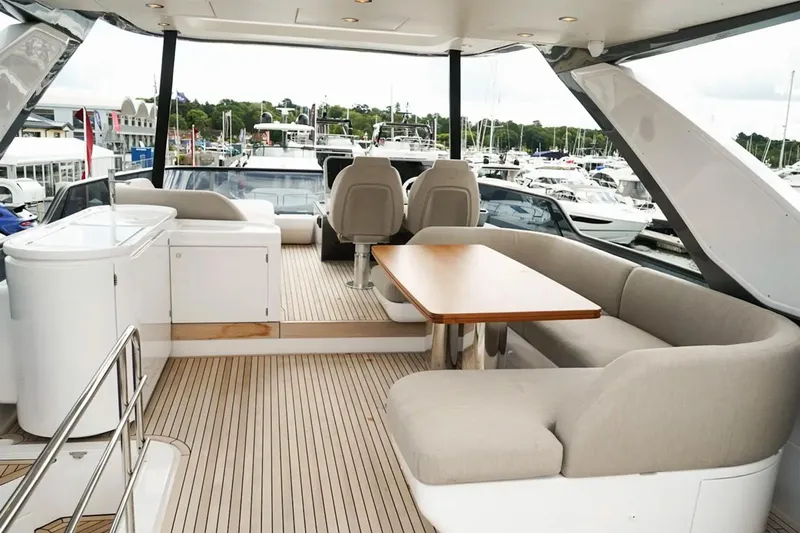  Yacht Photos Pics Luxurious 2024 Azimut Fly 68 yacht interior with elegant seating and dining area.