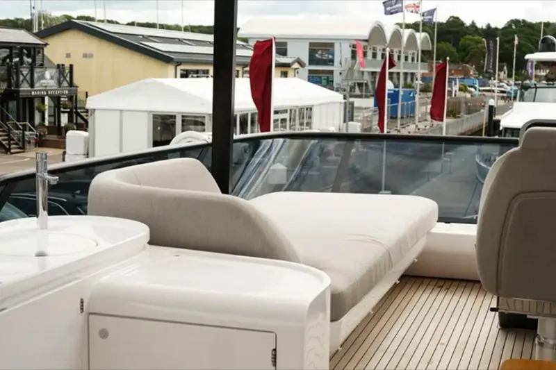  Yacht Photos Pics 2024 Azimut Fly 68 yacht deck with luxurious seating and marina view.