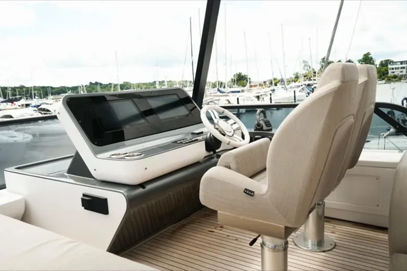  Yacht Photos Pics Luxurious helm of 2024 Azimut Fly 68 yacht with modern controls and plush seating.