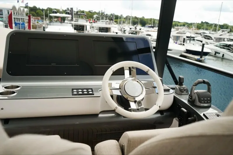  Yacht Photos Pics Cockpit of 2024 Azimut Fly 68 yacht with modern steering and controls.