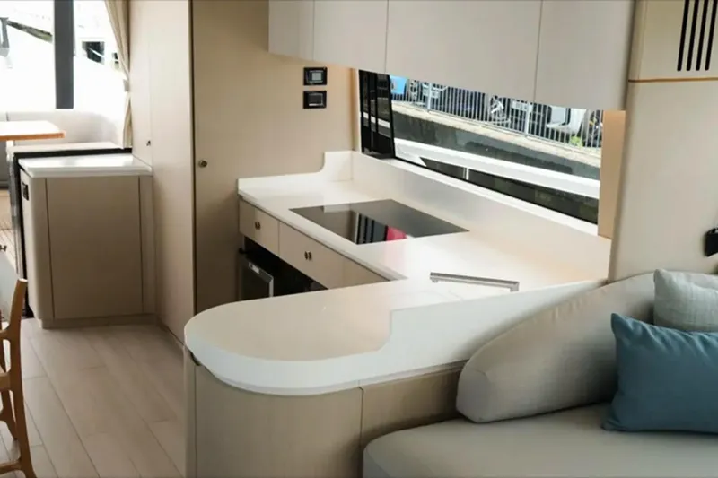 Yacht Photos Pics Luxurious interior of 2024 Azimut Fly 68 yacht with modern kitchen and seating area.