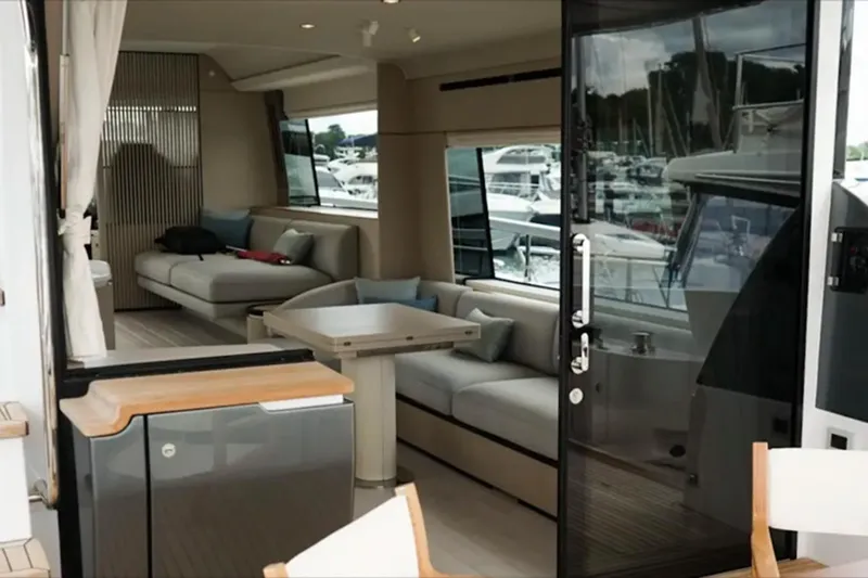  Yacht Photos Pics Luxurious interior of 2024 Azimut Fly 68 yacht with modern seating and marina view.