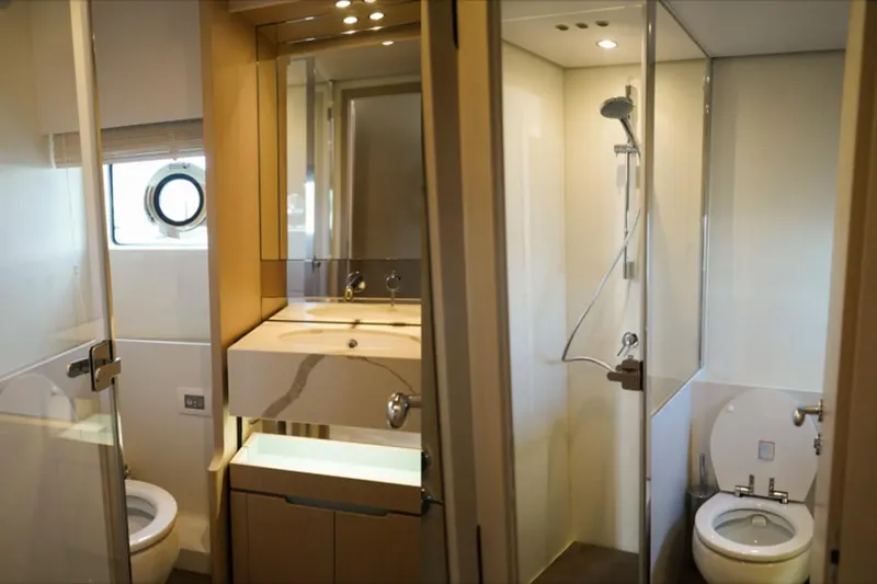  Yacht Photos Pics Luxurious bathroom in 2024 Azimut Fly 68 yacht with modern fixtures and shower.