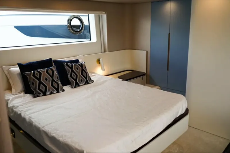  Yacht Photos Pics Luxurious bedroom interior of 2024 Azimut Fly 68 yacht with modern design and elegant decor.