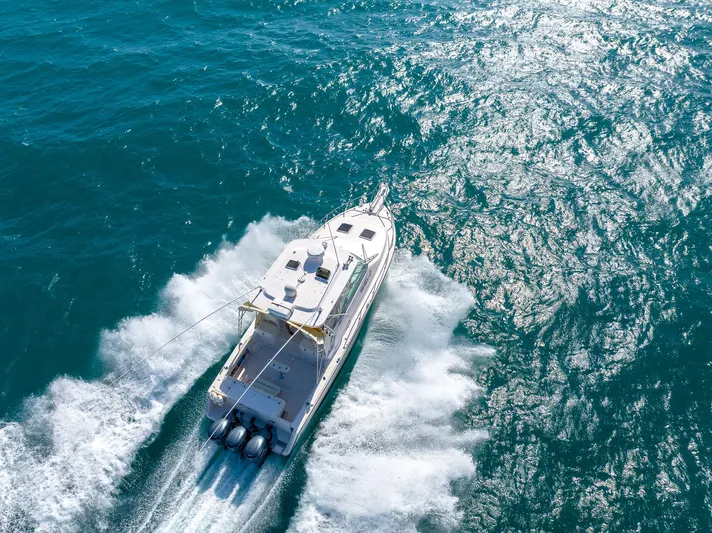  Yacht Photos Pics 2007 Grady-White Express 360 cruising on open water, aerial view.