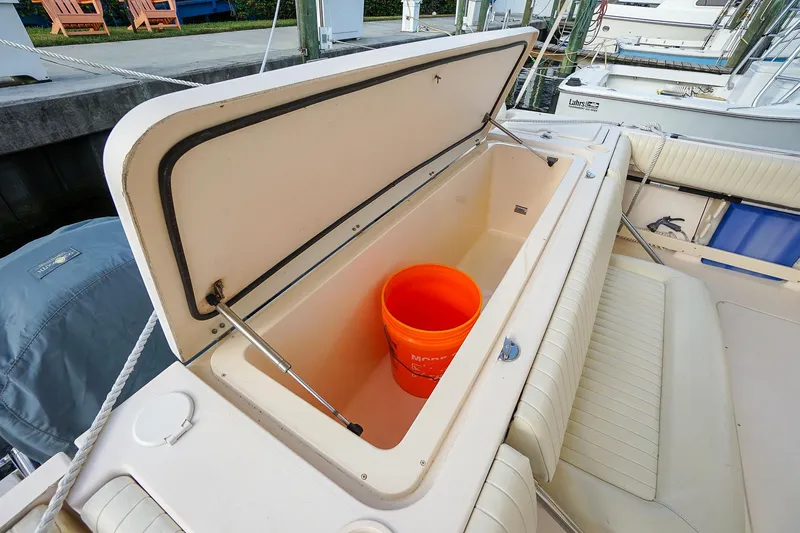  Yacht Photos Pics Open storage compartment on 2007 Grady-White Express 360 boat with orange bucket inside.
