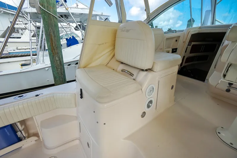  Yacht Photos Pics 2007 Grady-White Express 360 boat interior with cushioned seating and control panel.