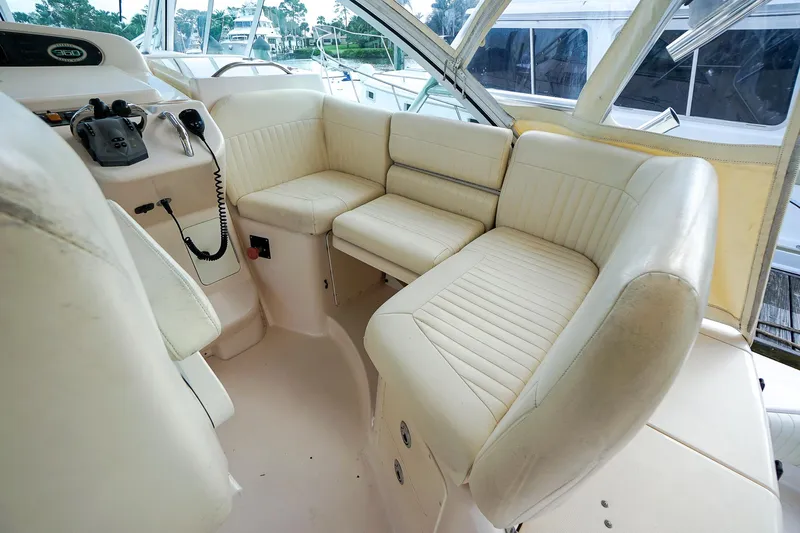  Yacht Photos Pics 2007 Grady-White Express 360 boat interior with cream leather seating and helm controls.