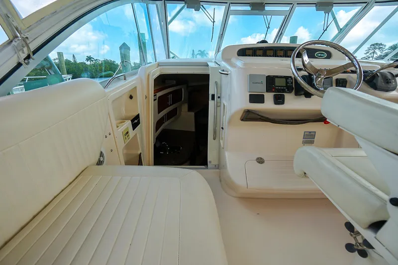  Yacht Photos Pics 2007 Grady-White Express 360 boat interior with helm and seating area.