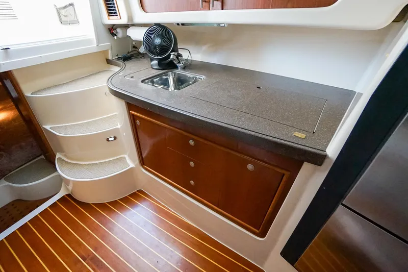  Yacht Photos Pics 2007 Grady-White Express 360 interior with kitchenette, sink, and wooden flooring.