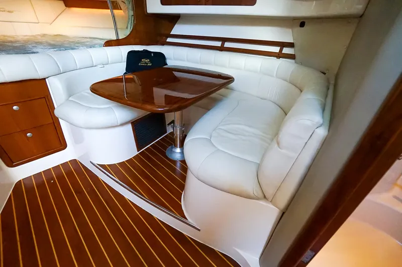  Yacht Photos Pics 2007 Grady-White Express 360 interior with white leather seating and wooden table.