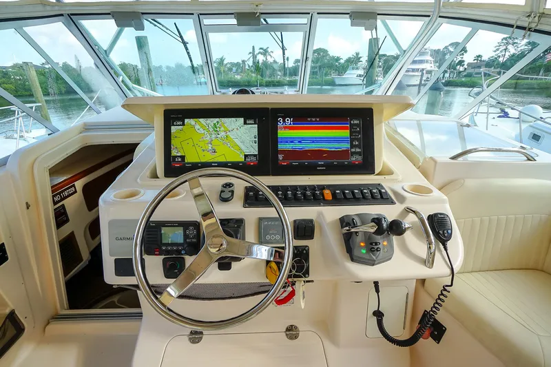 Yacht Photos Pics 2007 Grady-White Express 360 helm with navigation screens and steering wheel.